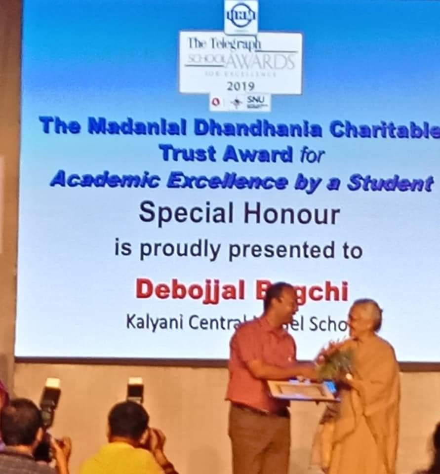 Father receiving Telegraph School Award